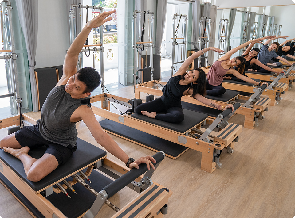 Group of people doing reformer