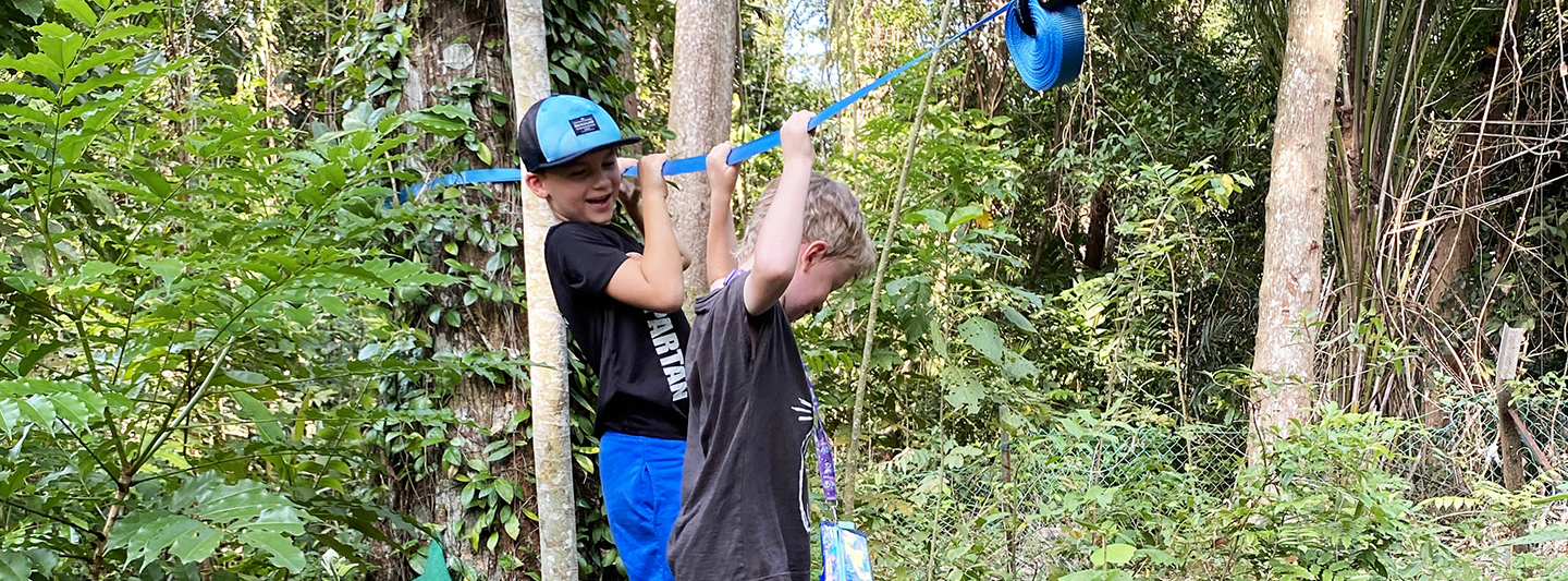 children doing activities in forest