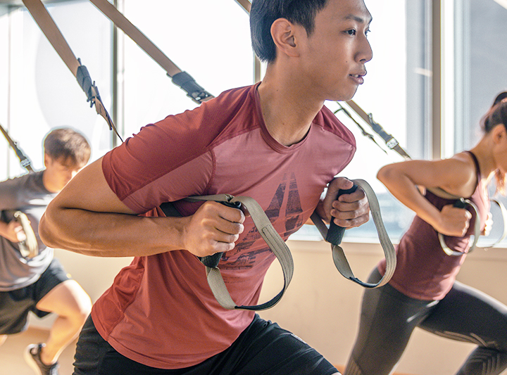 man training with TRX band