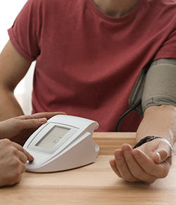 lifestyle assessment professional measuring blood pressure